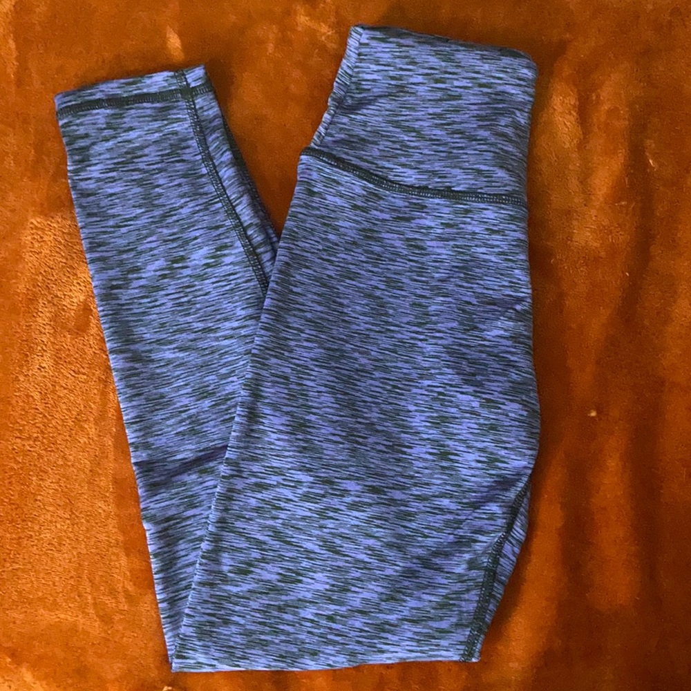 Black/purple striped fitness leggings.
